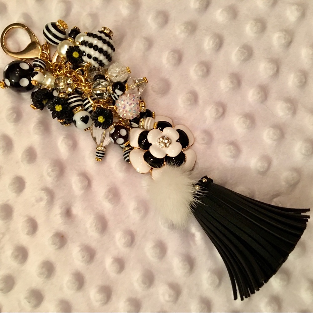 B & W CAMELLIA W/FUN DANGLES & BLACK TASSEL W/POM